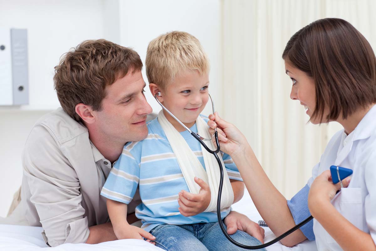 Friendly Doctor treating young boy - GP Clinic Clifton Hill