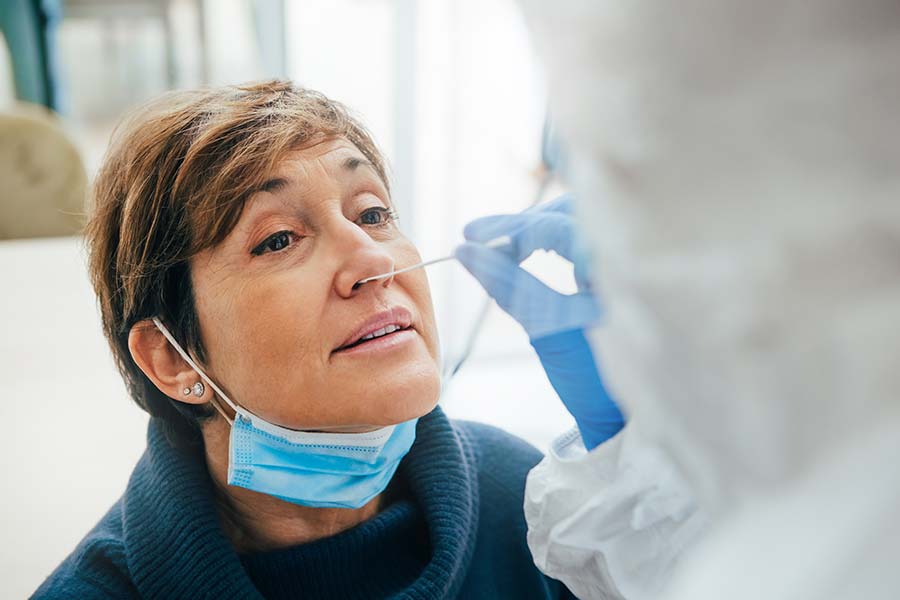 Female patient receiving a Covid-19 test for international travel from Melbourne